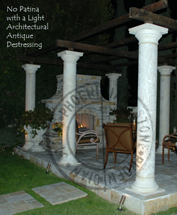 You are looking at new hand carved columns with no patina and a light architectural antique destressed finish